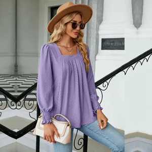 Detail of purple jacquard pleated square neck blouse with smocked cuffs on model
