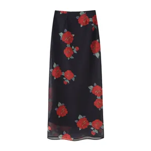 Detailed view of a fashion floral print long skirt featuring layered red roses on black fabric