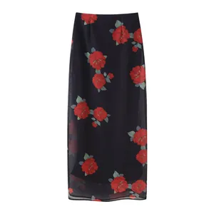 Detailed view of an elegant black floral print layered mesh maxi skirt with red rose pattern