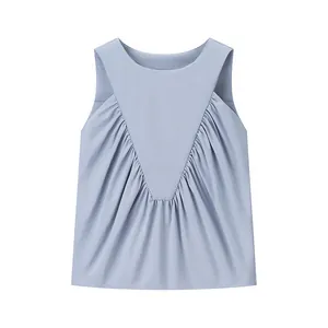 Macro view of light blue sleeveless fashion top with elegant V-shaped pleated details