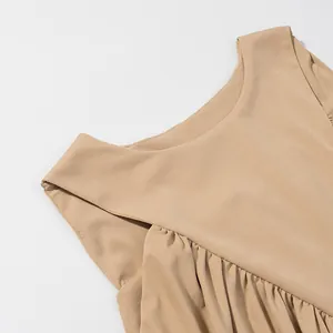 Close-up macro view of the gathered pleated neckline on this minimalist beige tank top