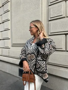 Street style detail of a printed faux two-piece cotton-padded jacket with geometric pattern