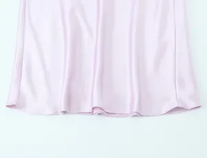 Detailed hemline of a lavender satin midi dress showcasing the smooth and glossy fabric texture