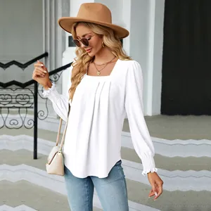 Detailed view of the white jacquard pleated square neck long sleeve blouse on model