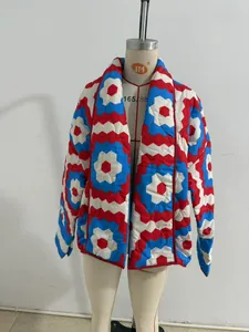 Detail of quilted kimono jacket with vibrant red, blue, and white geometric pattern