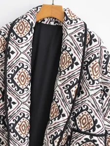 Detailed view of women's ethnic geometric print quilted jacket with fake two-piece collar
