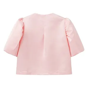 Back view of a pink satin cropped top featuring elegant puff sleeves and a pleat detail