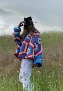 Street style women's printed kimono padded coat with vibrant geometric patterns in nature