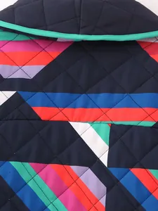 Macro detail of quilted patchwork pattern on colorful women's thin cotton jacket