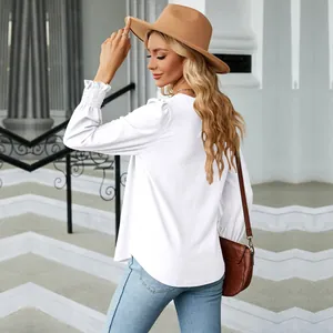 Back view of elegant white jacquard long sleeve blouse with pleated ruffled cuffs detail