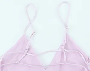 Detail view of a soft pink satin midi dress showing adjustable criss-cross back straps