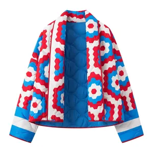 Close-up of quilted kimono jacket featuring vibrant red and blue geometric pattern.