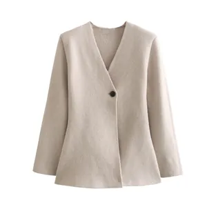 Front view detail of a minimalist beige women's knitted blazer jacket with single button