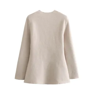 Back view of a beige knit blazer jacket showing the elegant silhouette and texture