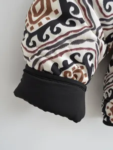 Close-up macro detail of the patterned cuff and fabric texture on a winter padded jacket