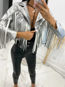 Detailed view of silver metallic biker jacket featuring long fringe decorations and lapels