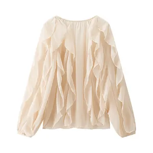 Close-up detail of the elegant cascading tiered ruffles on this beige spring blouse
