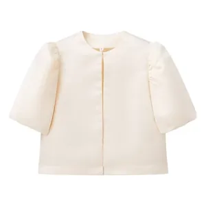 Elegant cream satin cropped top featuring chic puff sleeves and a modern open front design