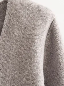 Detailed close-up showing the soft oatmeal knitted fabric of this women's blazer jacket