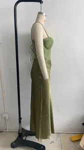 Side profile of an elegant olive green lace corset top and satin midi skirt set