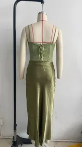 Back view of green lace corset top and olive satin midi skirt set with lace-up detail