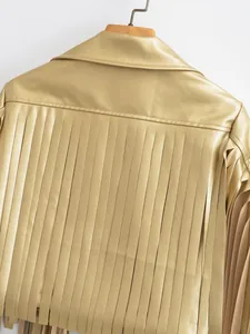 Detailed back view of champagne gold faux leather jacket featuring long stylish fringes