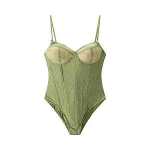 Detail shot of a sexy green lace bodysuit corset with delicate floral embroidery and thin straps