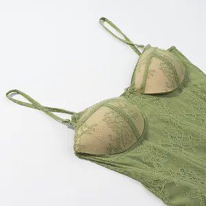 Close-up detail of the green floral lace corset top featuring padded cups and thin straps