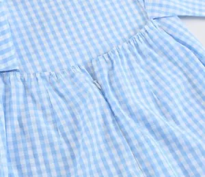 Detail view of the back invisible zipper on a blue gingham cotton linen dress.