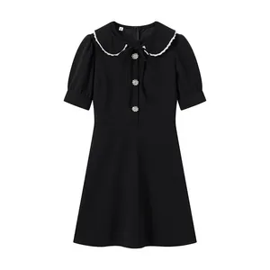 Black short-sleeved dress featuring a detachable white lace-trimmed Peter Pan collar