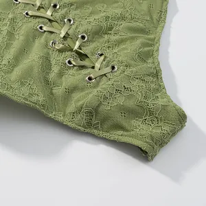 Macro detail of sexy olive green lace bodysuit with elegant satin lace-up ribbon closure