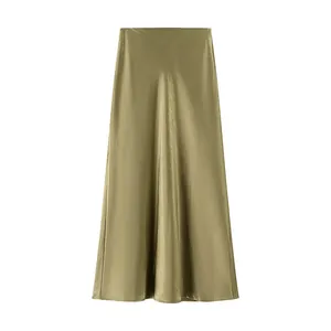 Detailed view of the elegant olive green satin fabric and flowing A-line skirt silhouette