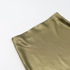 Detailed close-up showing the smooth texture and luster of olive green satin skirt fabric