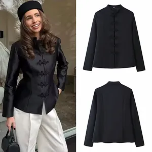 Elegant black Chinese-style blazer featuring stand collar and frog buttons shown in detail