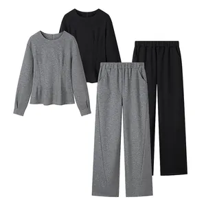 Women's autumn lounge set featuring long-sleeve top and wide-leg pants in grey and black.