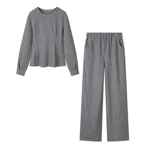 Detail view of a premium grey heathered long-sleeve top and wide-leg trousers set for women