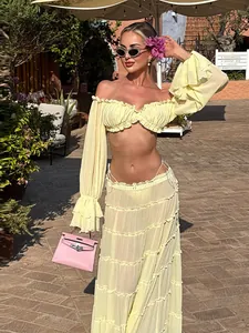 Full view of a sexy yellow off-shoulder top and tiered ruffles maxi skirt set for summer.