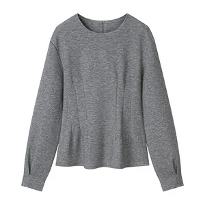 Close-up detail of gray long sleeve round neck top with waist gathered design for women