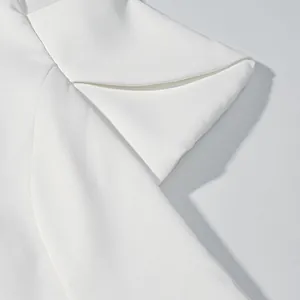Detailed macro view showing the elegant white petal sleeve design on a structured summer top