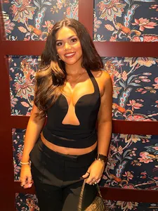 Close-up of a sexy black deep V-neck halter crop top showing fit and neckline detail