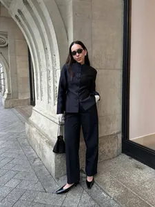 Elegant black Chinese-style cropped blazer with traditional frog button closures