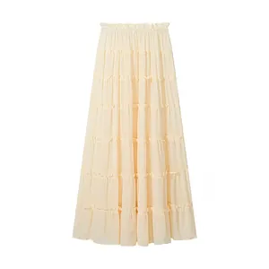 Detail view of tiered cream chiffon maxi skirt with elegant ruffles