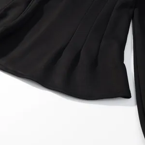 Close-up of black pleated hemline with smooth stitching detail