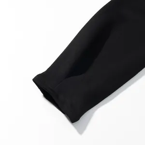 Detail shot of the black long sleeve cuff showing premium fabric texture and stitching
