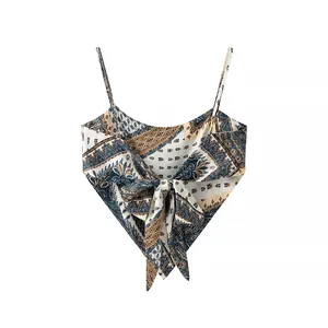 Detailed view of a bohemian paisley print camisole featuring a decorative front bow knot