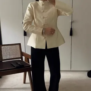 Elegant cream-colored Chinese style jacket with mandarin collar and traditional frog buttons