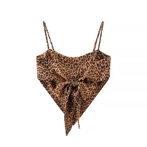Detailed view of a leopard print camisole with an irregular hem and decorative front bow tie