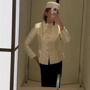 Elegant cream mandarin collar blazer with traditional frog closures in a slim fit style