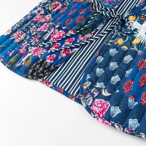 Detailed close-up showing the mixed floral and striped patterns of a quilted tie-front vest