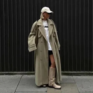 Professional street style photo of long khaki woolen trench coat with wide lapels for women